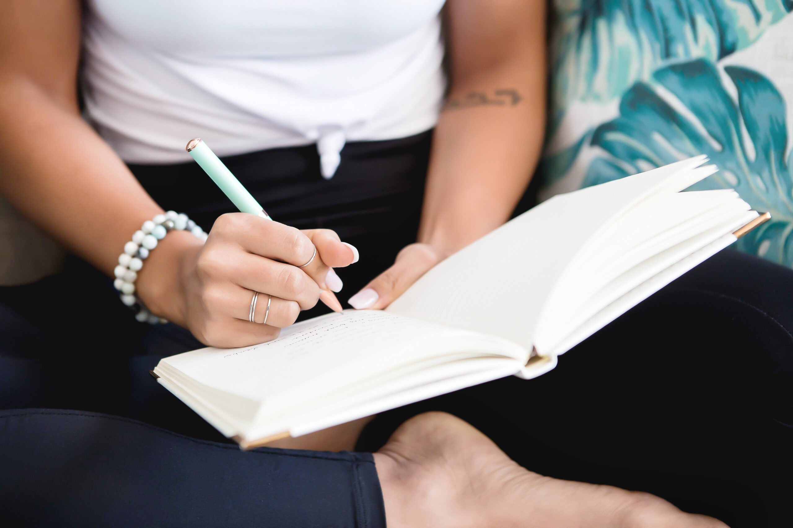 midlife woman writing in a journal
