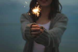 Lost Your Sparkle? Misalignment Happens focus photo of a woman holding sparklers